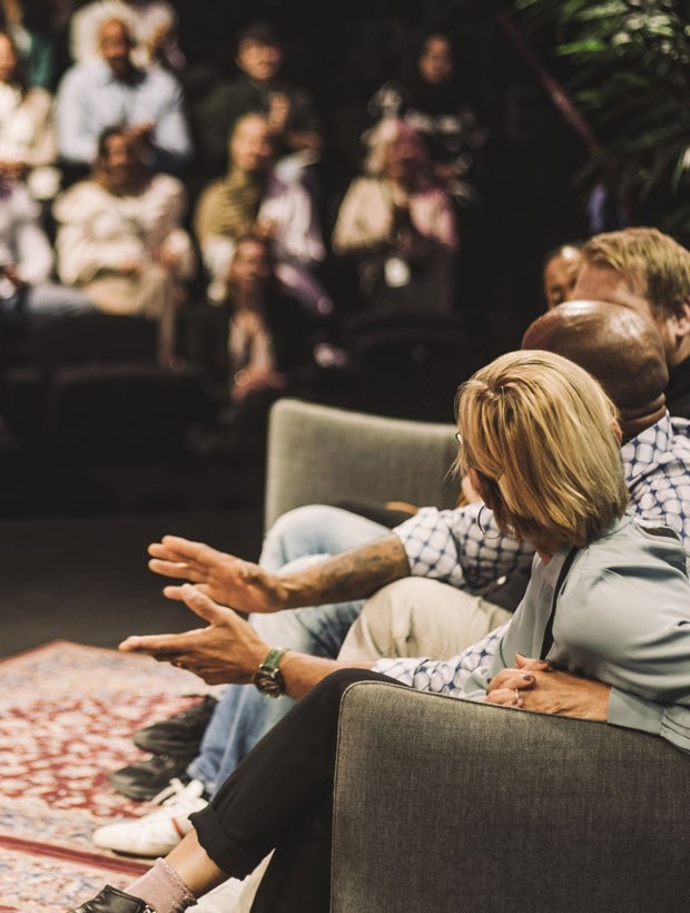 back of woman presenting at an event