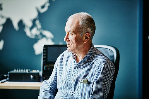 Businessman listening during project discussion in high tech office